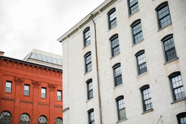 istock stone buildings with large windows symbolizes stability and strength with a connection to nature. Stone represents durability, while large windows convey openness and a desire for natural light 1478788290