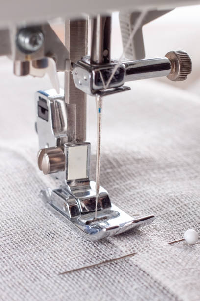 istock Modern sewing machine presser foot with linen fabric and thread, closeup 1478788999