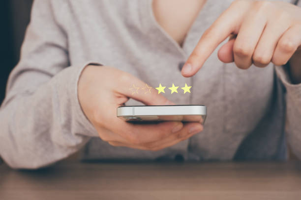 istock Business woman touching and doing mark to three yellow stars on virtual touch screen. feedback rating and positive customer review, experience, satisfaction survey concept. 1478790049