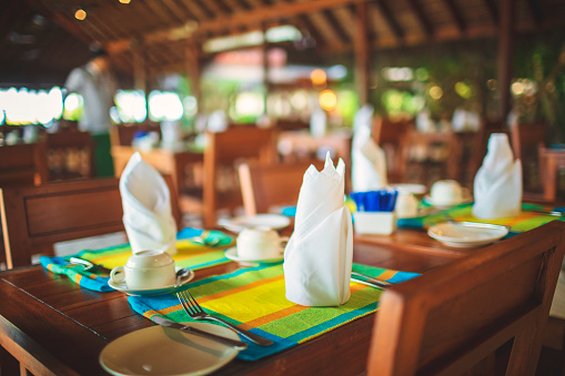 istock Beautifully set dining table in an open plan restaurant by the sea in the Maldives 1478790472