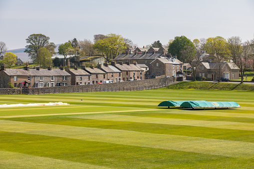 Sedbergh, Yorkshire, UK - 20 April 2019: View if the buildings of the Sedbergh village. School playground. Sunny spring day. Yorkshire Dales, UK