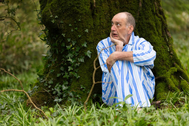 Senior man with memory problems lost in the woods
