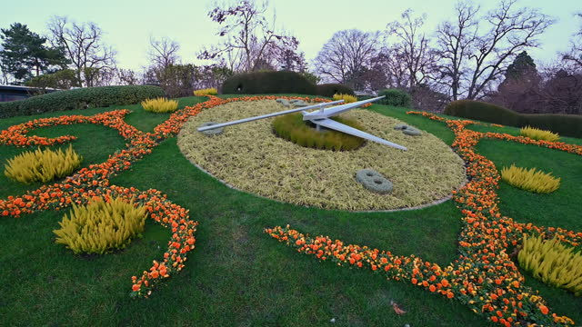 Geneva, Switzerland, January 2023. Tourist attraction of the city the flower clock in the lakefront public gardens. You see the second hand moving rapidly. Time running out.
