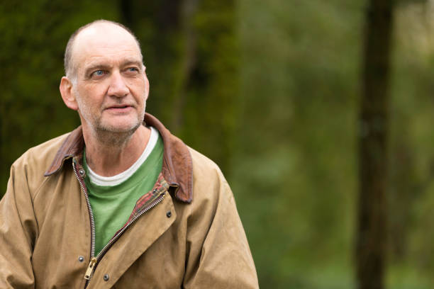istock Elderly man out in the woods 1478806326