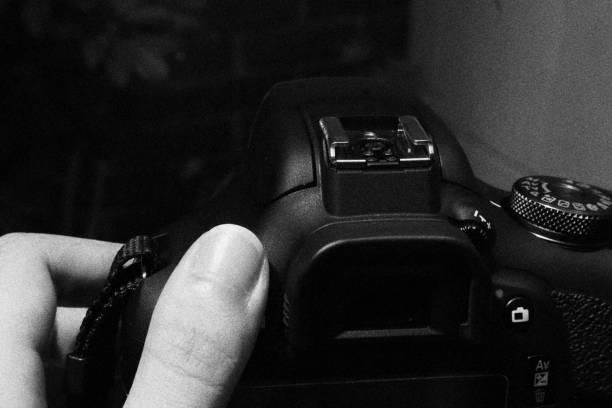 istock Photographer Getting Ready to Take Picture with her Digital Camera. Monochromatic Black and White Tones 1478808134