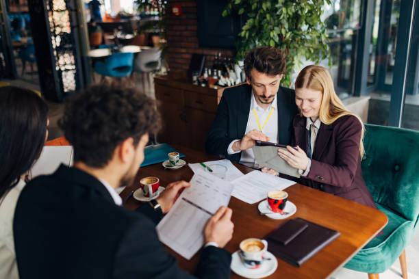 istock Small group of entrepreneurs having meeting in restaurant 1478813964