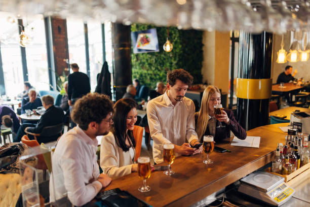istock Group of office workers drinking beer together in pub 1478823744