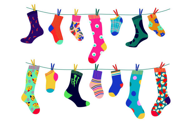 illustrazioni stock, clip art, cartoni animati e icone di tendenza di calzini su una corda con mollette colorate - sock wool multi colored isolated