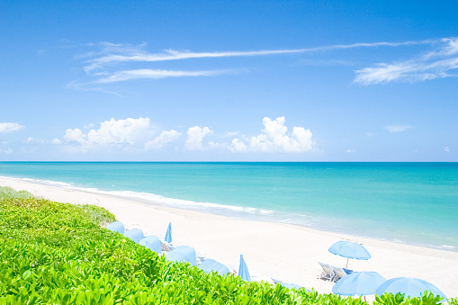 An empty white sand beach on the gulf coast of Destin, Florida.