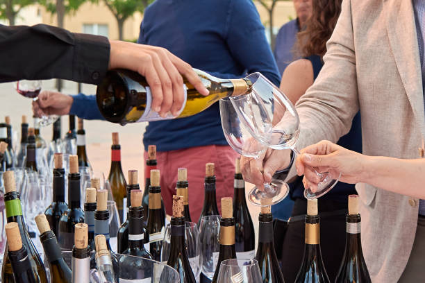 istock person pouring champagne in two glasses 1478832812