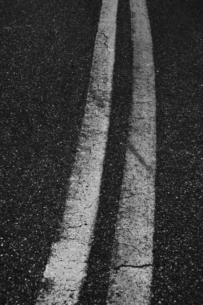 istock Continuous Track on Asphalt. Monochromatic Black and White Tones 1478836128