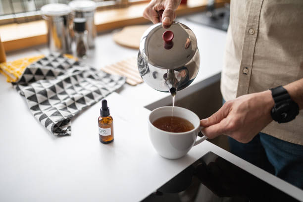istock Man added CBD oil into tea 1478837936
