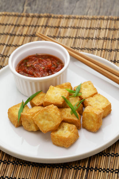 istock crispy cubed tofu puffs with chili sauce 1478842670