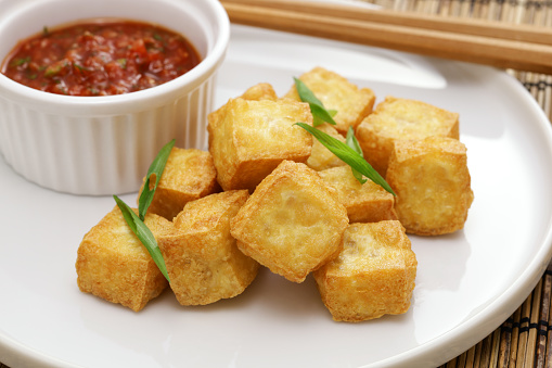 crispy cubed tofu puffs with chili sauce