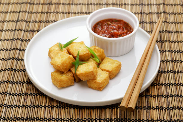 istock crispy cubed tofu puffs with chili sauce 1478842672