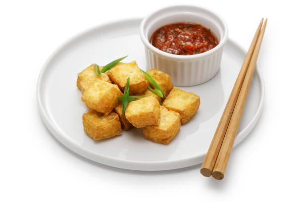 istock crispy cubed tofu puffs with chili sauce 1478842673
