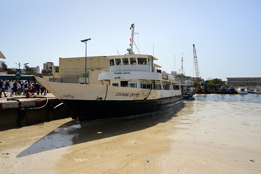 Dakar, Senegal: Gorée Island ferry docked at the maritime terminal, the Coumba Castel - Autonomous Port of Dakar (PAD). Many locals travel on this route, but Gorée Island also attracts many tourists interested in its slave trade past, in particular African-Americans.