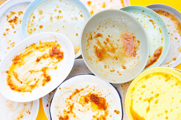 istock Dirty dishes on yellow background. Top view 1478870049