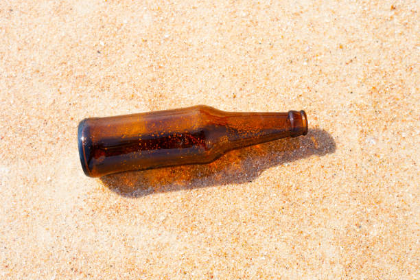 istock Glass bottle on the beach 1478871066