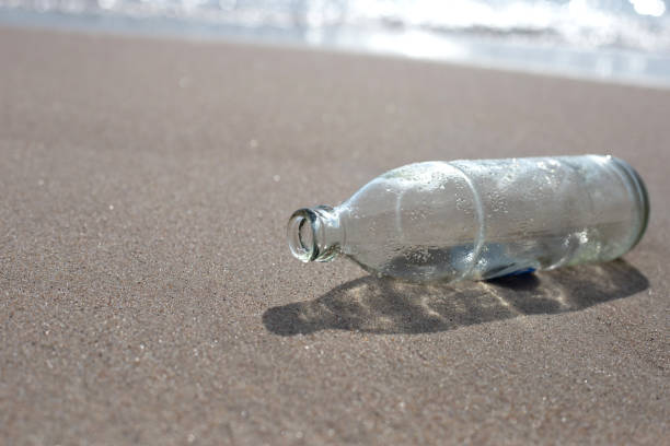 istock Glass bottle on the beach 1478874526
