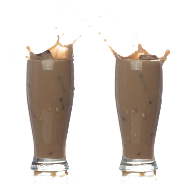 istock Milk Tea fall pouring down in Shape form line. Milk Ice coffee splash spill drop droplet out of glass, chocolate cocoa attack fluttering explosion in air. White background isolated, stop motion 1478879351