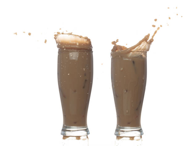 istock Milk Tea fall pouring down in Shape form line. Milk Ice coffee splash spill drop droplet out of glass, chocolate cocoa attack fluttering explosion in air. White background isolated, stop motion 1478879383