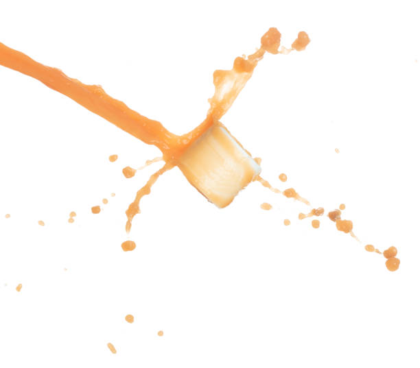 istock Orange Juice moisturizer lotion cream pouring down in cosmetic bottle container. Orange paint beauty lotion fluttering explosion in air, splash spill like explosion droplet. White background isolated 1478880312
