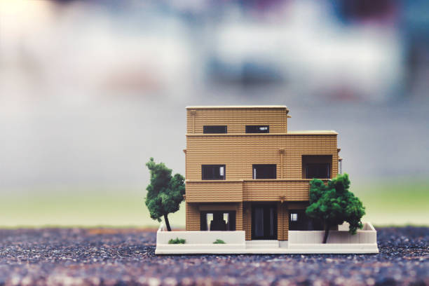 istock Miniature house model and blur background 1478887426