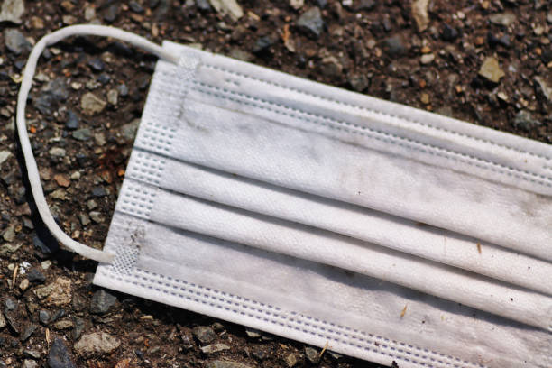 istock dirty white mask on the ground 1478889518