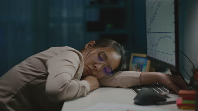 Tired woman sleeping with work at home office, Zoom out