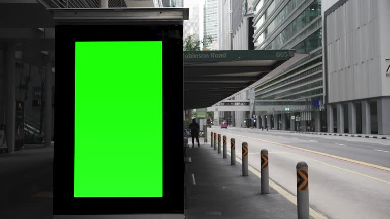 Green wrinkled poster template in city. Glued paper mockup. Empty street art sticker mock up. Clear urban glued advertising canvas. Billboard advertisment advertiser.