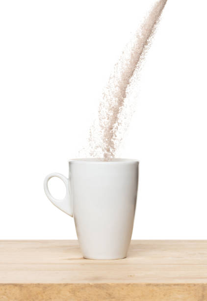 istock 3 in 1 instant coffee powder mixed fly fall in cup, 3 in 1 instant coffee for fast easy float in air. 3 in 1 instant coffee throw in mid air. White background isolated high speed freeze motion 1478897540