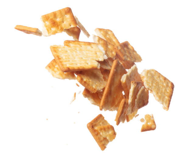 istock Cracker Butter square fall fly in mid air, golden crispy cracker Butter square floating. Cracker Butter crack crunch throw in air. White background isolated freeze motion high speed shutter 1478901465