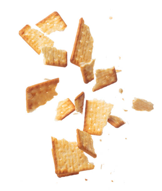 istock Cracker Butter square fall fly in mid air, golden crispy cracker Butter square floating. Cracker Butter crack crunch throw in air. White background isolated freeze motion high speed shutter 1478901656