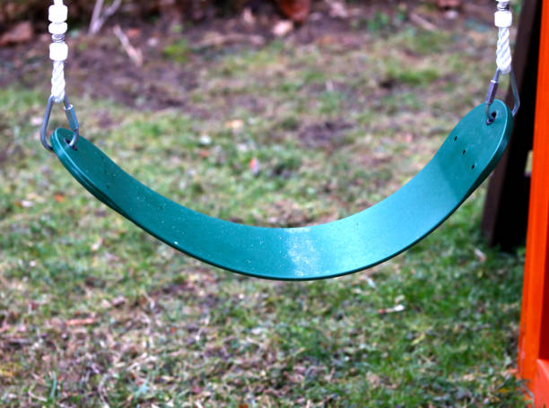 istock Children's green playground swing 1478904672