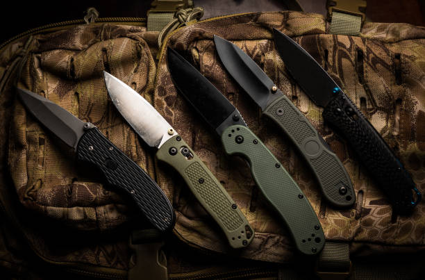 istock Varous EDC folding pocket knives flat lay on tactical bag 1478911077
