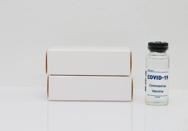 istock An ampoule with a vaccine and two white small boxes. 1478913679