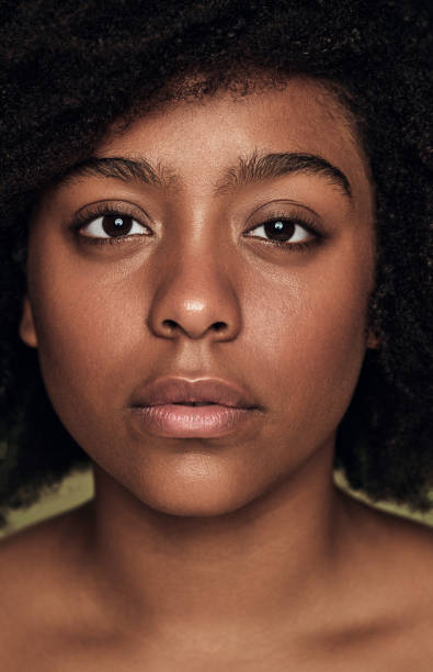 istock Crop emotionless young black lady looking at camera in studio 1478914045
