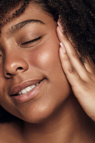 istock Crop happy young ethnic lady smiling with closed eyes while touching face 1478914139