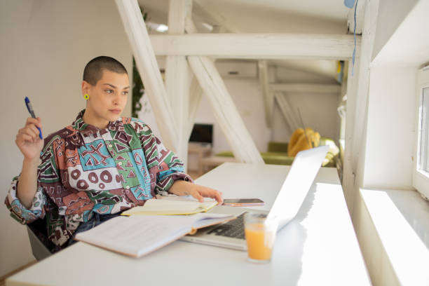 Young entrepreneur is working from home stock photo