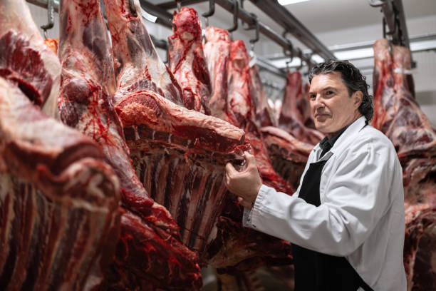istock Butcher in the butcher's cold room. 1478916239