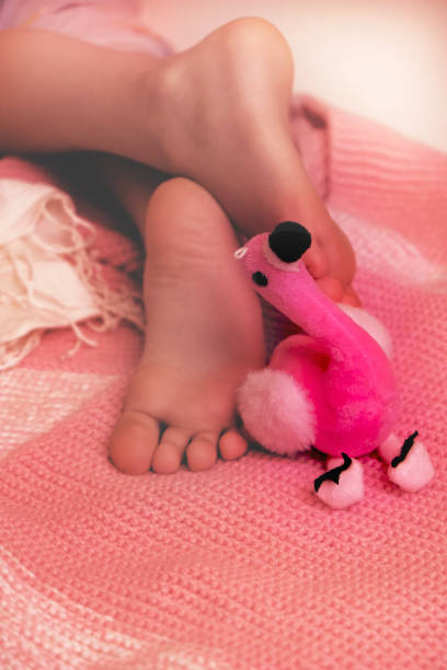 istock Barefoot, relaxing with toy. Lazy holiday concept 1478918333
