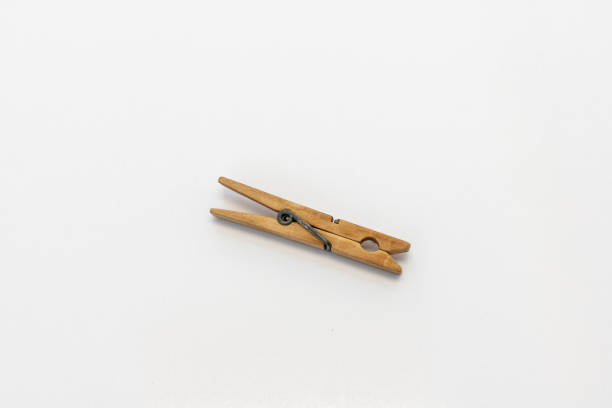 istock classic wooden clothespin isolated on white background. selective focus 1478922800