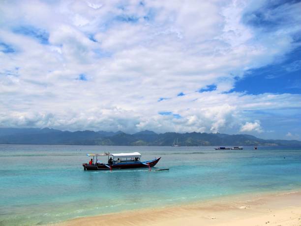 istock Boat sailing on the beach 1478942436