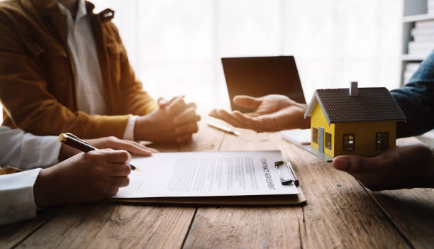 istock Couples young owners signed a contract for a home investment. 1478942969