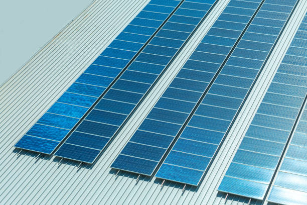 istock Installing alternative energy photovoltaic solar panels on roof 1478951139