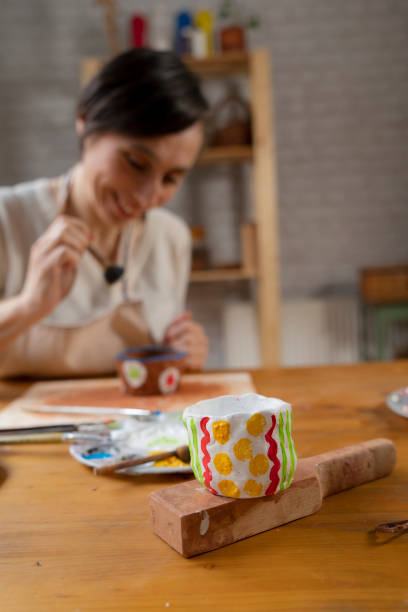 istock Woman painting a pottery 1478952618