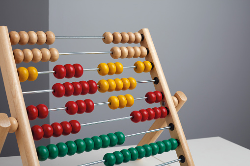 Four colored abacus on a table