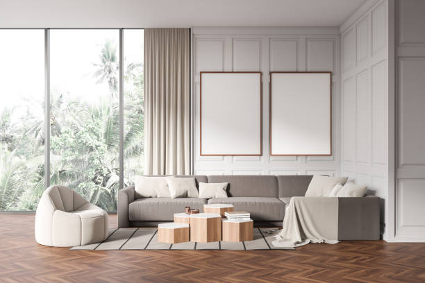 istock Stylish living room interior with armchair and couch with decor, mockup frames 1478956254