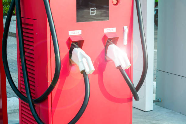 istock Electric car charging station for charge EV battery. Plug for vehicle with electric engine. EV charger. parking lot. Future transport technology. 1478957591